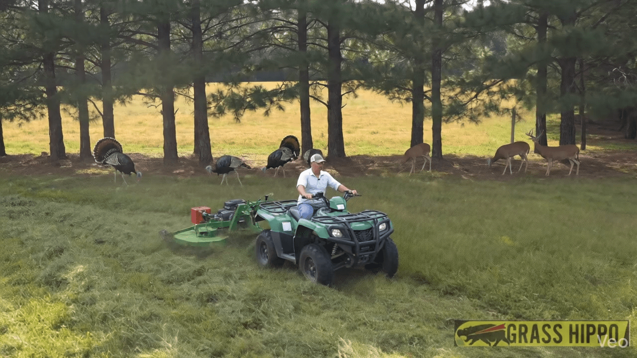 man operating mower